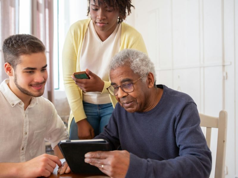 Family reviewing course material together on a tablet