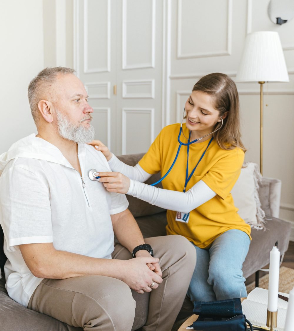 Caregiver checking on an elderly resident at home